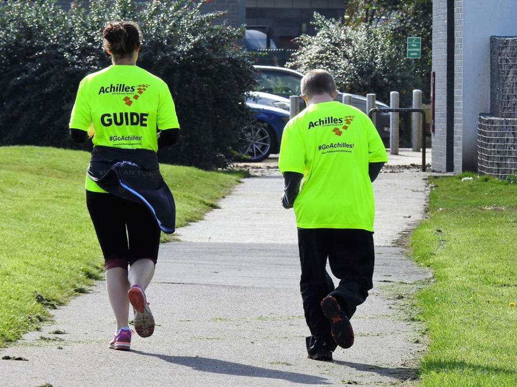 Lauren McAllister and Danny Byrne run together. Achilles is aimed at helped people of all abilities to take part in mainstream running events.