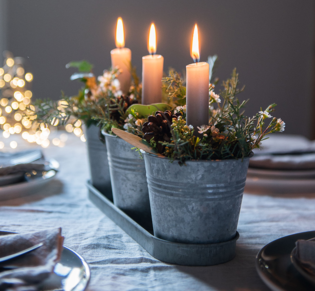 Candle and foliage table centre