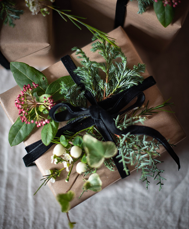 Present wrapped and decorated with foliage