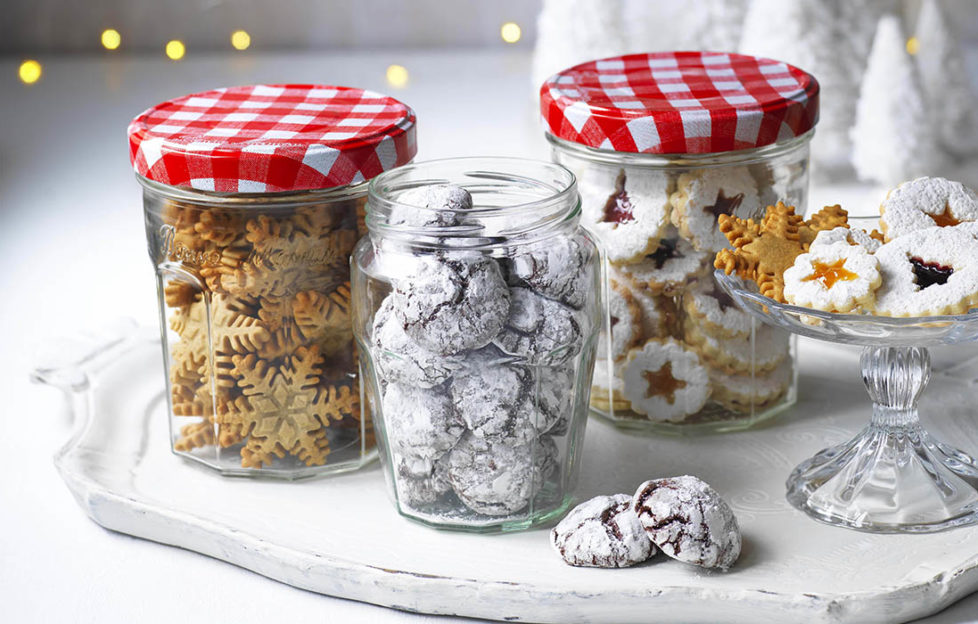 3 jars of Bonne Maman tiny festive biscuits and some on a cake stand