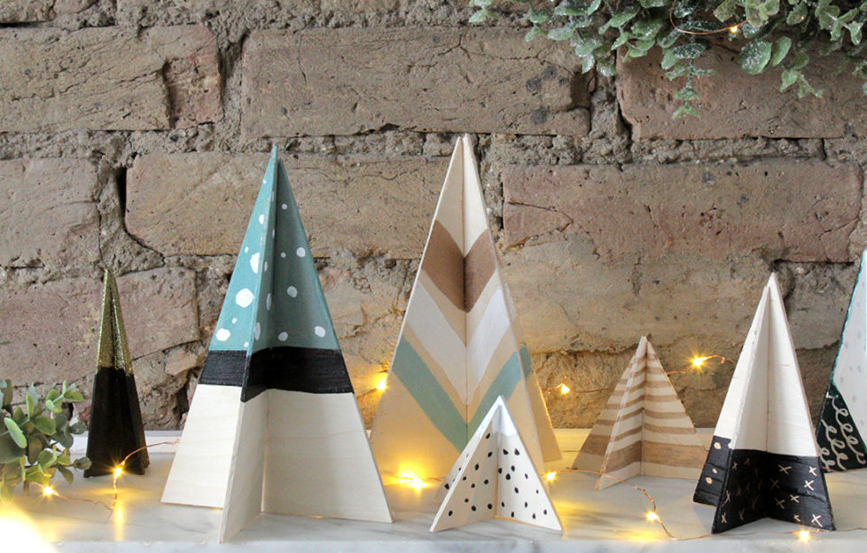 Plywood Scandi Christmas tree decorations, intersecting triangles painted in black, green and white stripes, spots and chevrons using Rust-Oleum paint