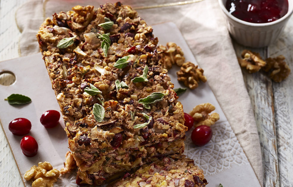 Golden, crumbly nut loaf with cranberries and oregano leaves