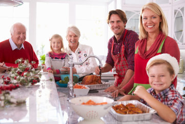 Family in kitchen at Christmas Pic: Shutterstock