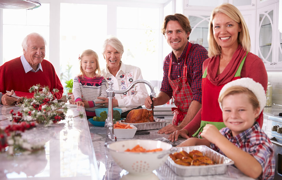 Family in kitchen at Christmas Pic: Shutterstock