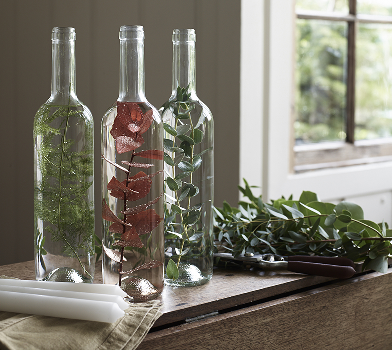 Foliage and water in bottles