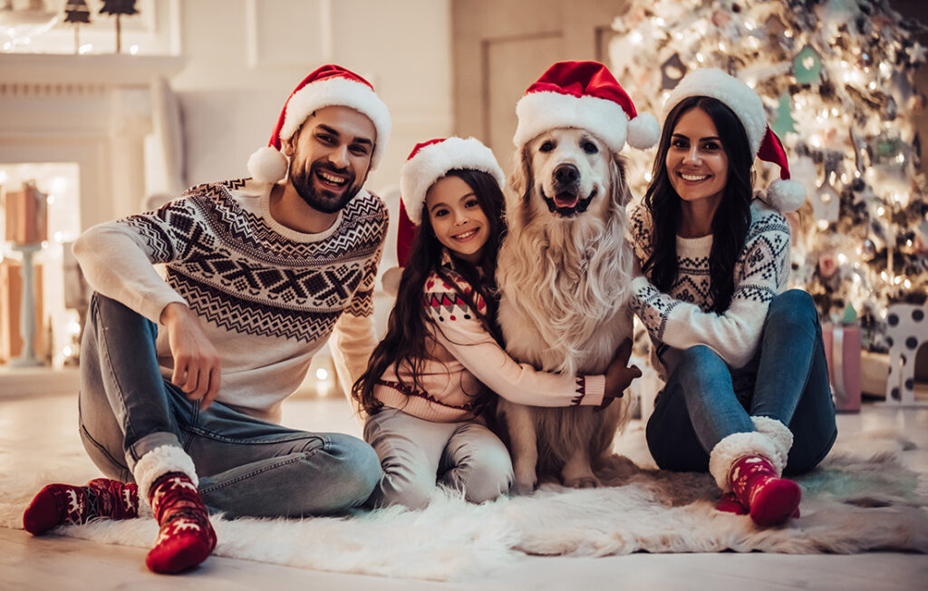 A family and dog in Christmas outfits or accessories Pic: Shutterstock