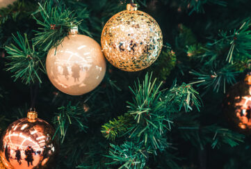 Close up of golden bauble on Christmas tree