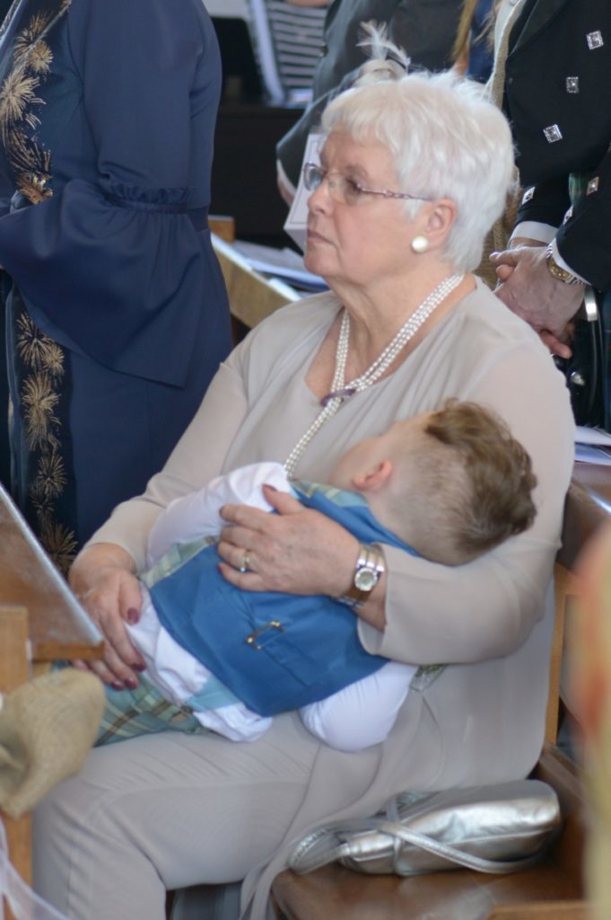 William Irving takes a break in the arms of his paternal grandmother Margaret