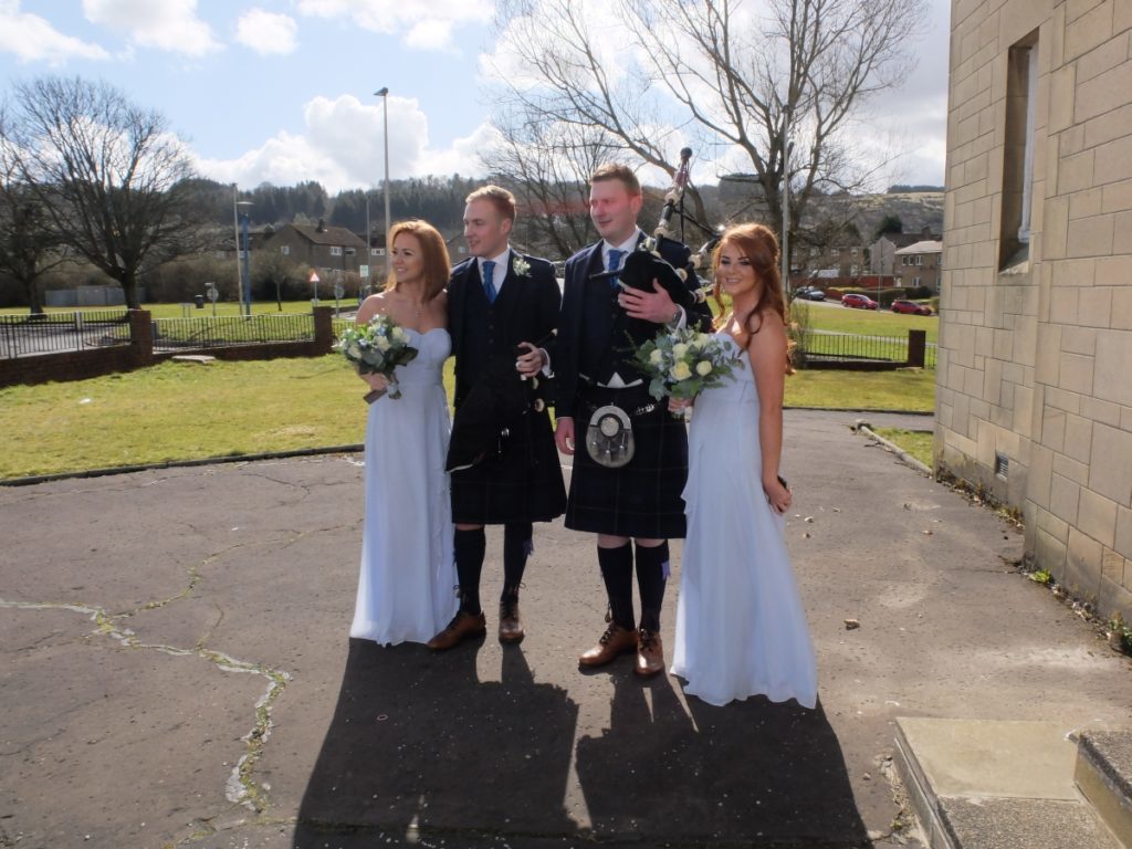 The bridesmaids and pipers.