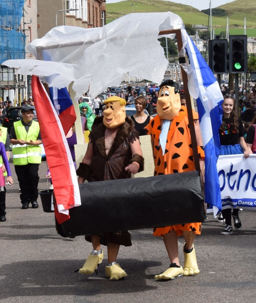 Fred Flintstone and Barney Rubble were guests on the Carni-West parade.