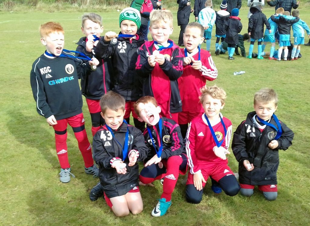 Campbeltown Barcelona and Campbeltown Real Madrid 2011s with their medals.