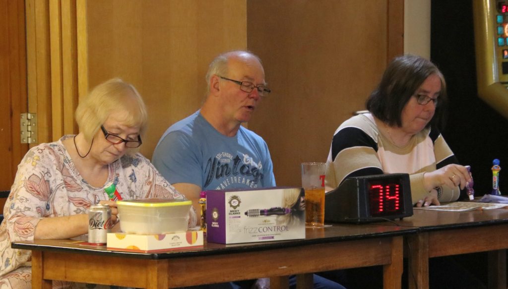 Isobel Dalziel, Donny McCrimmon and Elizabeth McCrimmon concentrate on the numbers.