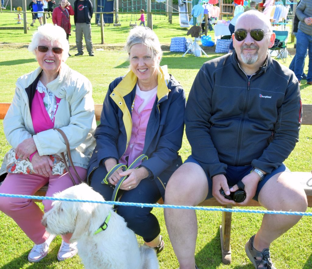 Jan Angus from Machrihanish with her daughter and son-in-law Corrine and Gordon Ross from Tain, with dog, Gigha, waiting for the games to begin.