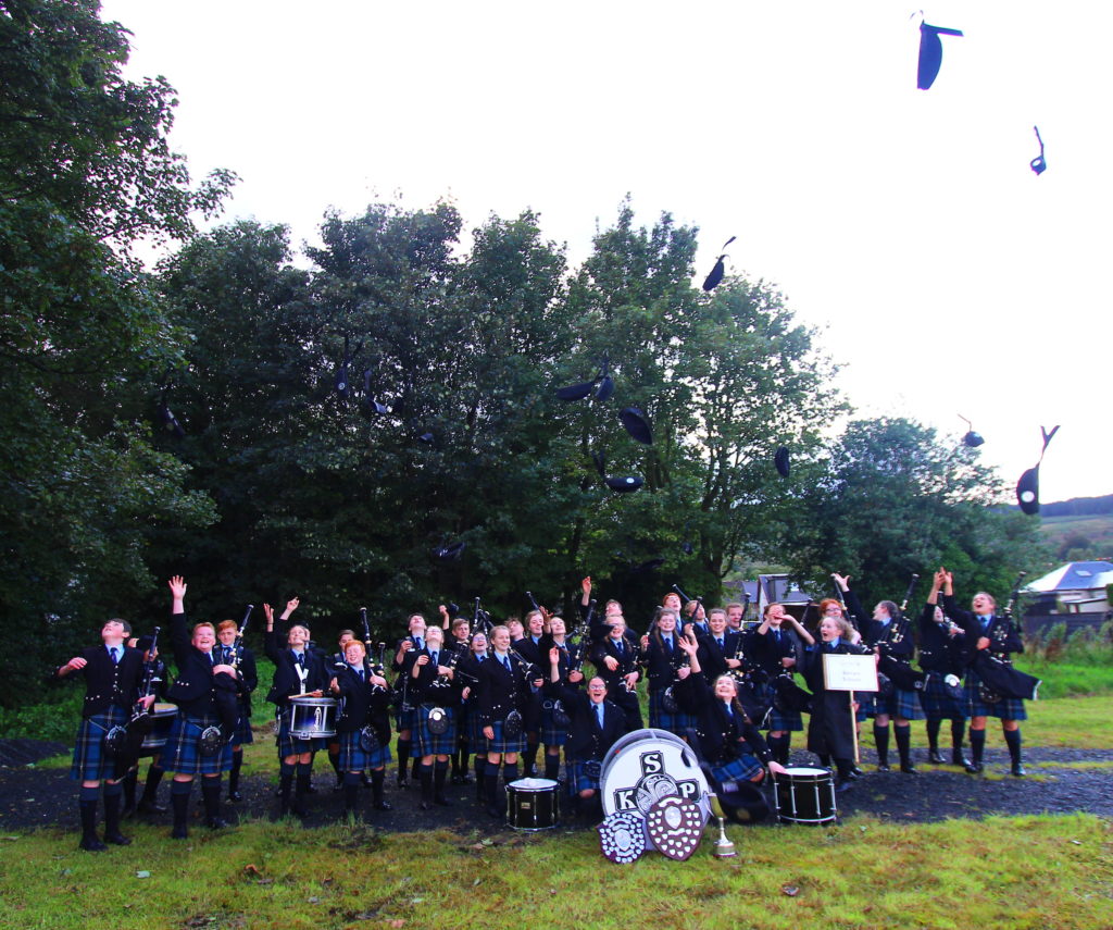 Members of KSPB toss their glengarries in celebration of being placed first in their section at Cowal Highland Gathering. Photograph: Gilbert McKillop.