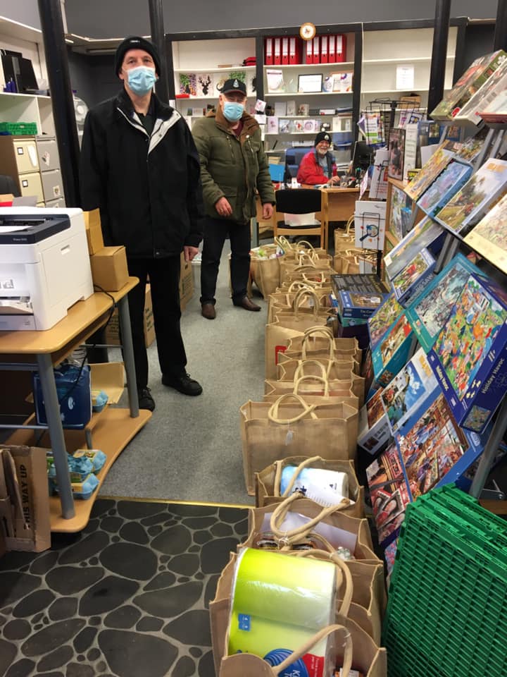 The charity delivers shopping throughout Kintyre. This photograph shows Ian Lawrie, Jim Turner and, at the back, David Lavery with bags ready to be loaded into the two, sometimes three, vehicles required for the Carradale run.