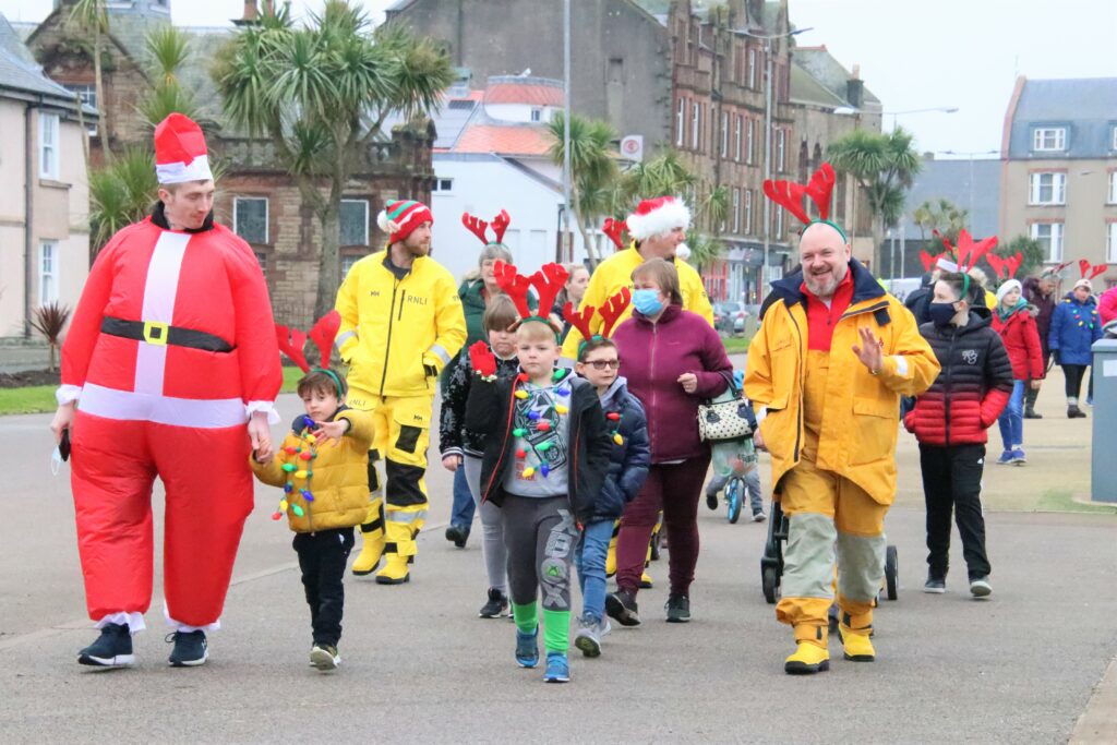 Event organiser Jake Sanders, dressed as Santa Claus, led the way as the group set off.