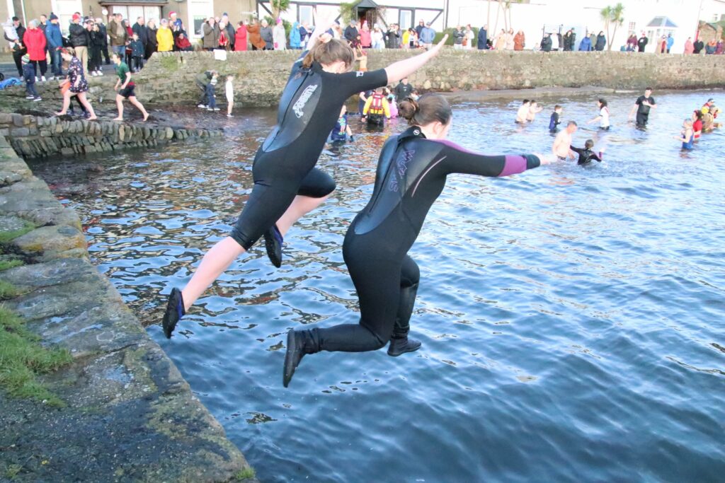 Spectators lined the street and safety personnel were on standby in the water as the first dippers entered the loch.
