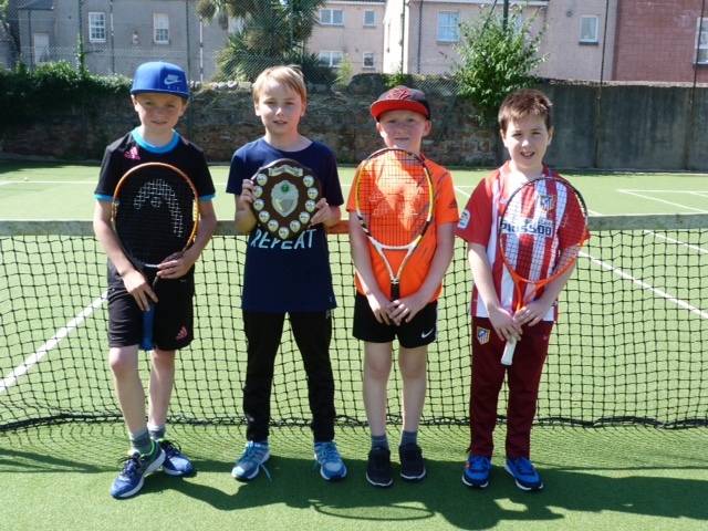 Young ace secures tennis shield