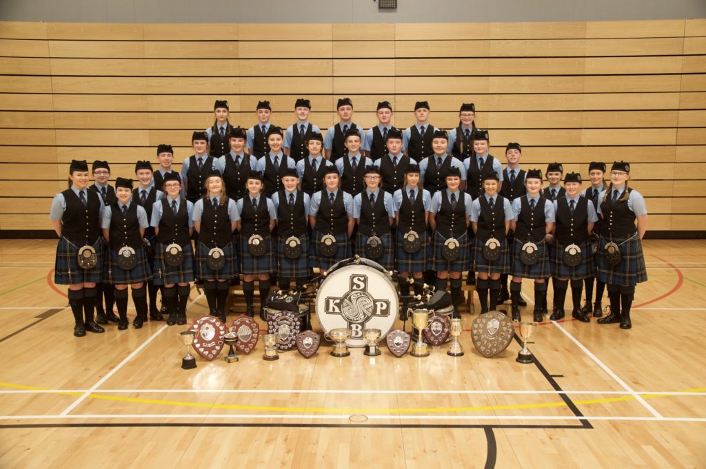The band with silverware won last year. This photograph was taken by Stuart Andrew of Kintyre Photography. Kintyre Pipe Band Association thanks him for taking the photograph of the band and allowing it to be printed alongside this article.