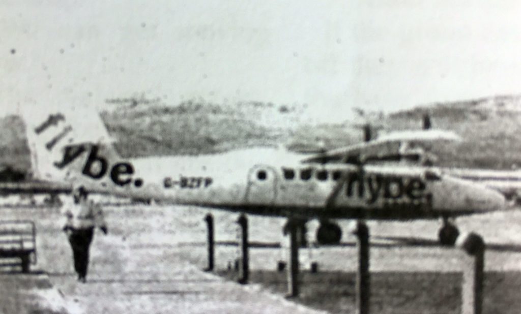 Margaret McSporran walks back to the terminal building at Campbeltown Airport after helping passengers board the morning flight to Glasgow on Tuesday, one of the few scheduled planes to fly that day.