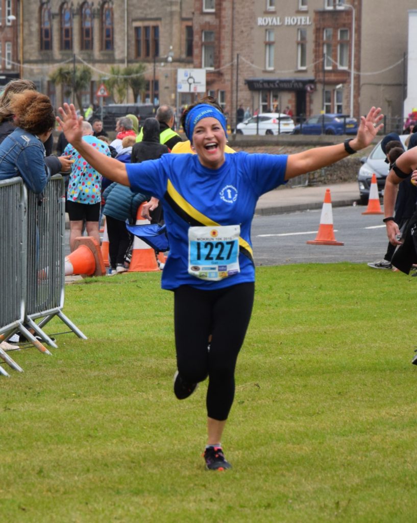 Race director Gail Williams was in good spirits as she neared the finish line.