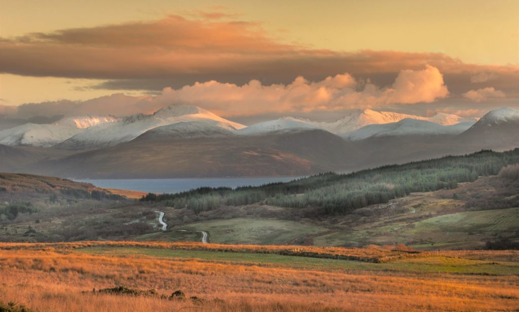The atmospheric shot, taken by Bob Goodman from Campbeltown on January 4, shows the last rays of the sun shining over a frost-covered forest road in East Kintyre with the north west coast of Arran in the background.