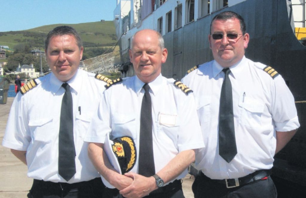 In 2011: Captain David Allen, centre, with Harbour Master Stephen Scally, left, and assistant David Martin; all three used to work on fishing vessels in Campbeltown together.
