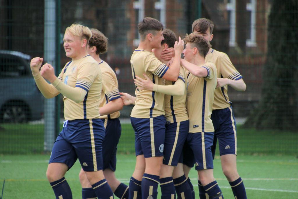 The young Pupils players celebrate two wins out of two.