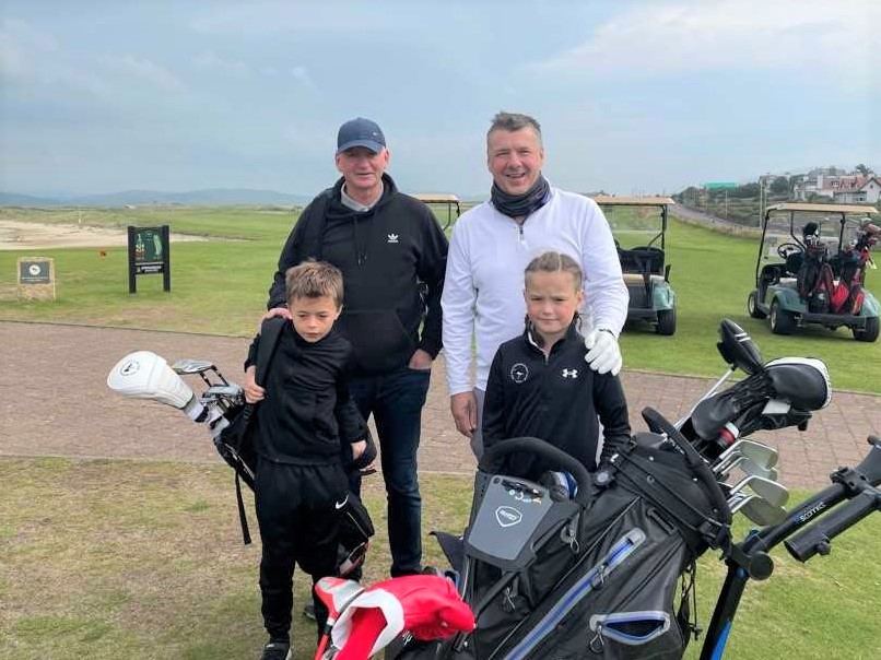 Family Greensome winners Craig and George MacMillan, left, with Blaze and Lee Mathieson who finished in 7th place.