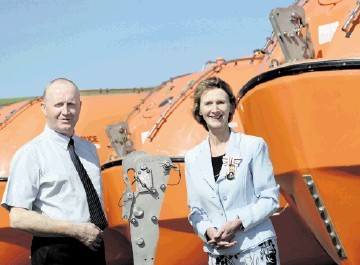 COMMITMENT: Angus Campbell with Carol Kinghorn at the marine-safety firm’s Findon base. Kami Thomson