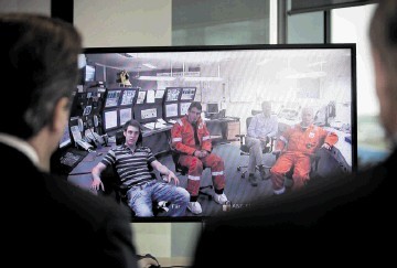 Prime Minister David Cameron talks to the crew of the Clair platform via video link during his visit to BP