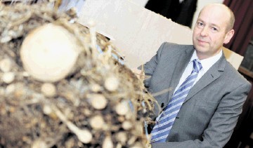 GREEN SPIRIT: The Macallan distillery general manager Graham MacWilliam with a brash bundle that could be burned for power. Gordon Lennox
