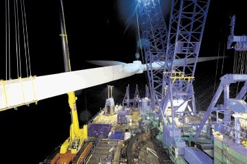 MAMMOTH TASK: Installing turbines at the Ormonde windfarm in the Irish Sea. Inset: New construction vessel ordered by Swire