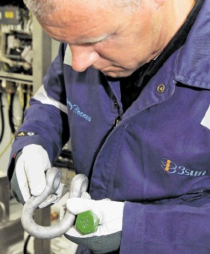 NEW DIVISION: A 3sun Group worker inspects components for defects