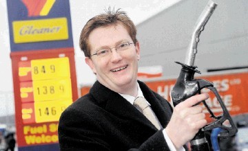 PRICE CUT: Chief Secretary to Treasury  Danny Alexander    launches the   fuel rebate  scheme for the  isles, at  Uig Filling Station.  Sandy McCook