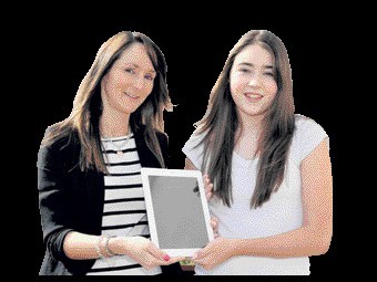 Mintlaw Academy pupil Rachel Massie receives her iPad from Tammy Fairclough of Shell St Fergus