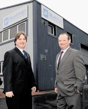 LOOKING FORWARD: Alex McDonald, right, and John McDonald outside Muehlhan Surface Protection at Dyce. Colin R   ennie