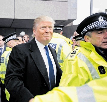 SHOW’S OVER: Donald Trump gets a police escort as he leaves Holyrood