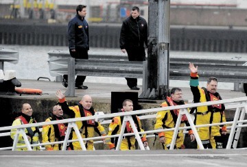 Passengers from the Puma helicopter come off the lifeboat  at Aberdeen Harbour.   Colin Rennie