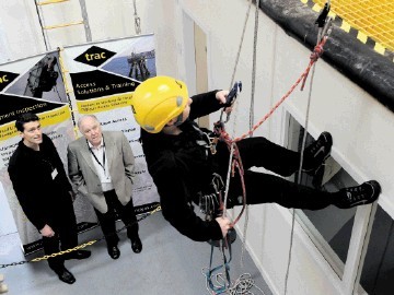 Danny Hawthorn and Craig Brown watch a demonstration at Trac’s Dyce premises.