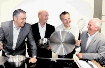 CREATING A STIR:  Nick Nairn, with Press and Journal Energy Ball 2012 sponsors, from left, Gavin Murray, Michael Lacey and Neil Bremner,  at the celebrity chef’s Aberdeen cook school, in Back Wynd. Colin Rennie