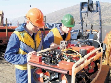 HANDS-ON: Two students from the Underwater Centre get to grips with  a remotely operated vehicle