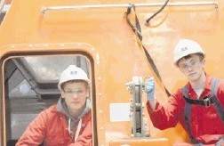 NEW RECRUITS ON BOARD:  SCI apprentices Josh Buchanan, left, and Craig Niddrie, right, with Angus Campbell