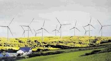 An impression of how the wind turbines would look beside the village
