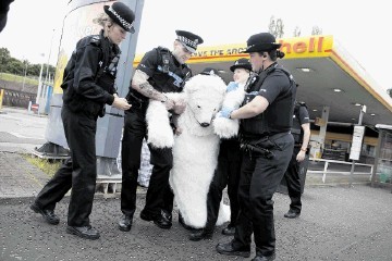 ICY RECEPTION: A Greenpeace campaigner attempts to shut a Shell petrol station in protest at the firm’s Arctic oil plans