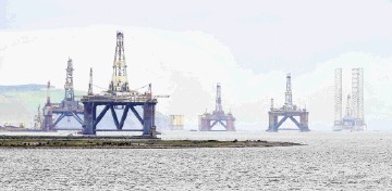 North Sea oil platforms sit in the Cromarty Firth.