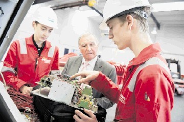 NEW RECRUITS: Sir Malcolm Bruce meets apprentice electricians Michael Glover, left, and Shaun Mitchell