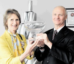 HONOURED: Carol Kinghorn presents the Queen’s Award rosebowl to Ian Kirk