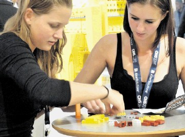 TECHNICAL CHALLENGE: Visitors to production technology firm Aibel’s stand at ONS have a go at some Lego construction