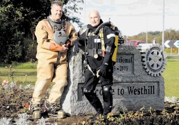 CHANGED DAYS: Dressed in vintage and modern diving gear, Divex defence manager Bill Elrick, left,  and senior technician Bob Thomson